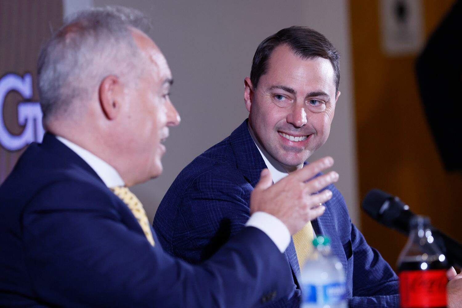 New Georgia Tech athletic director J Batt listens as Tech President Angel Cabrera speaks during Batt's introductory news conference Monday. (Miguel Martinez / miguel.martinezjimenez@ajc.com)