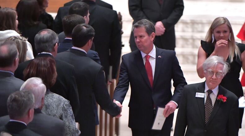 Governor-Elect Brian Kemp greets Lieutenant Governor-Elect Geoff Duncan as he leaves with wife Marty Kemp and daughters Jarrett, Lucy, and Amy Porter after the inauguration day prayer service at The Cathedral of St. Philip at The Cathedral of St. Philip on Monday, January 14, 2019.