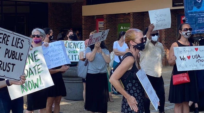 University of Georgia faculty members and employees gathered outside the Tate Student Center on Sept. 14, 2021 for a rally for mandates and other measures to mitigate the spread of COVID-19 on campus. ERIC STIRGUS/ERIC.STIRGUS@AJC.COM.