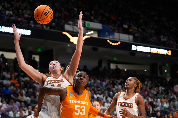 Texas forward Taylor Jones (44) ballets for a loose ball against Tennessee forward Jillian Hollingshead (53) during the first half in the Sweet 16 of the NCAA college basketball tournament, Saturday, March 29, 2025. in Birmingham, Ala. (AP Photo/Gerald Herbert)