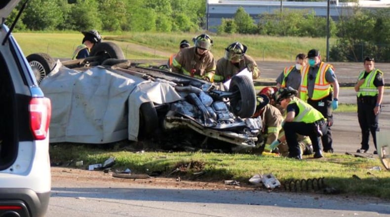 Rome-Floyd County firefighters respond to the scene of a crash that killed a 51-year-old woman and her 18-year-old son Tuesday afternoon.