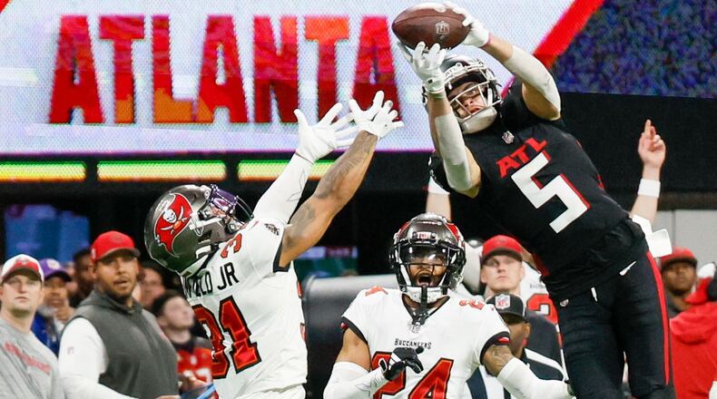 Atlanta Falcons wide receiver Drake London (5) goes up for an impressive reception during the fourth quarter against the Tampa Bay Buccaneers on Sunday, Dec. 10, 2023, at Mercedes-Benz Stadium in Atlanta. Miguel Martinez/miguel.martinezjimenez@ajc.com