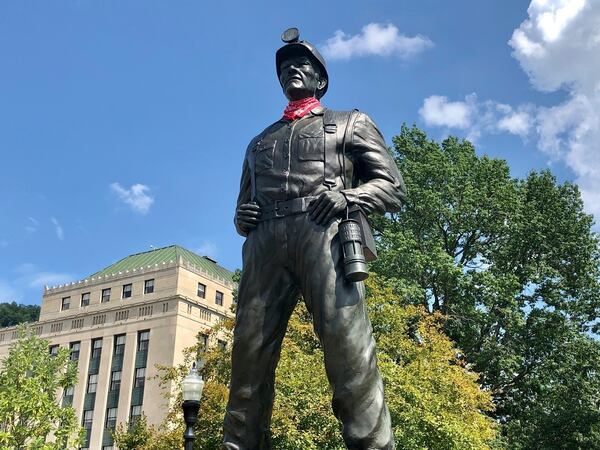 FILE - A statue of a coal miner stands at the West Virginia Capitol in Charleston, W.Va., Aug. 26, 2021. (AP Photo/John Raby, File)