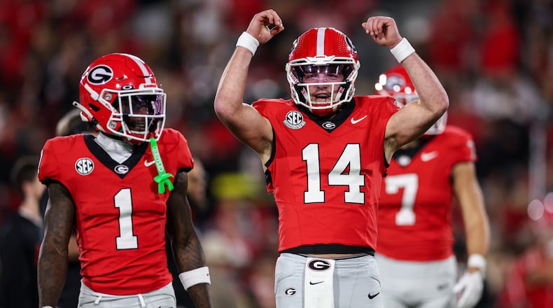 Georgia quarterback Gunner Stockton (14) reacts during pregame warmups before the start of an NCAA college football game against Texas, Saturday, Nov. 15, 2025, in Athens, Ga. (AP Photo/Colin Hubbard)
