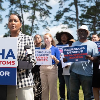 Former Atlanta mayor and Democratic nominee for governor Keisha Lance Bottoms campaigns outside of a shuttered rural hospital in Commerce in June. (Riley Bunch/AJC)