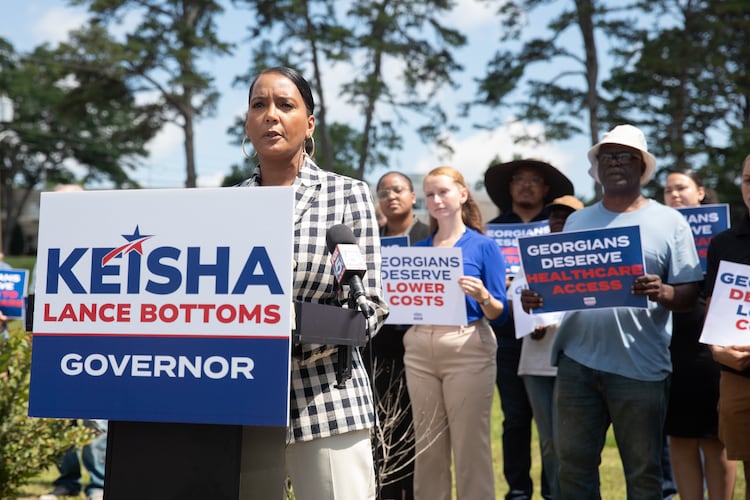 Former Atlanta mayor and Democratic nominee for governor Keisha Lance Bottoms campaigns outside of a shuttered rural hospital in Commerce in June. (Riley Bunch/AJC)