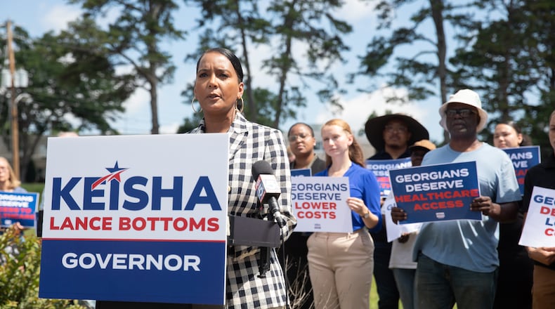 Former Atlanta mayor and Democratic nominee for governor Keisha Lance Bottoms campaigns outside of a shuttered rural hospital in Commerce in June. (Riley Bunch/AJC)