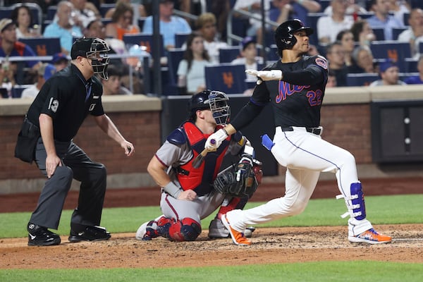 New York Mets' Juan Soto hits a home run during the sixth inning of a baseball game leading Brandon Nimmo to score against the Atlanta Braves Monday, June 23, 2025, in New York. (AP Photo/Pamela Smith)