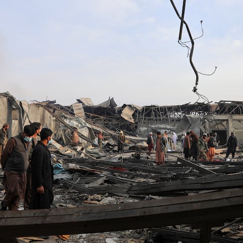 Residents and volunteers inspect the site of a late-Monday airstrike at a drug rehabilitation hospital in Kabul, Afghanistan, Tuesday, March 17, 2026. (AP Photo/Siddiqullah Alizai)
