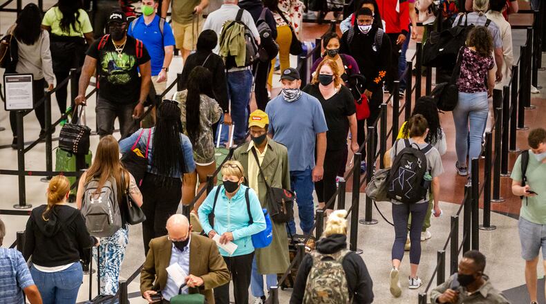 Long lines form at Hartsfield-Jackson Atlanta International Airport Sunday, May 9, 2021. STEVE SCHAEFER FOR THE ATLANTA JOURNAL-CONSTITUTION