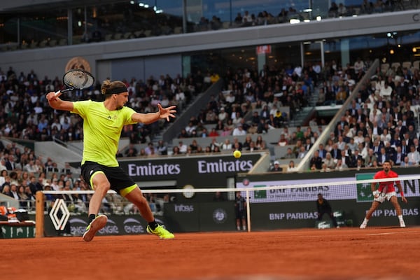 Germany's Alexander Zverev plays a shot against Serbia's Novak Djokovic during their quarterfinal match of the French Tennis Open at the Roland-Garros stadium in Paris, Wednesday, June 4, 2025. (AP Photo/Lindsey Wasson)