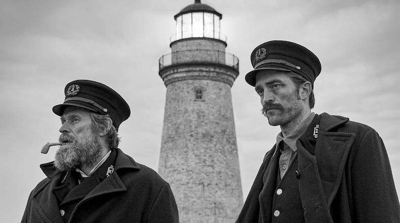 Willem Dafoe, left, and Robert Pattinson star in “The Lighthouse.” Eric Chakeen/A24 Pictures