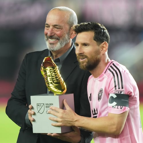 MLS Commissioner Don Garber presents the Golden Boot award to Inter Miami forward Lionel Messi before match one of their MLS playoff opening round soccer match against the Nashville SC, Friday, Oct. 24, 2025, in Fort Lauderdale, Fla. (AP Photo/Marta Lavandier)
