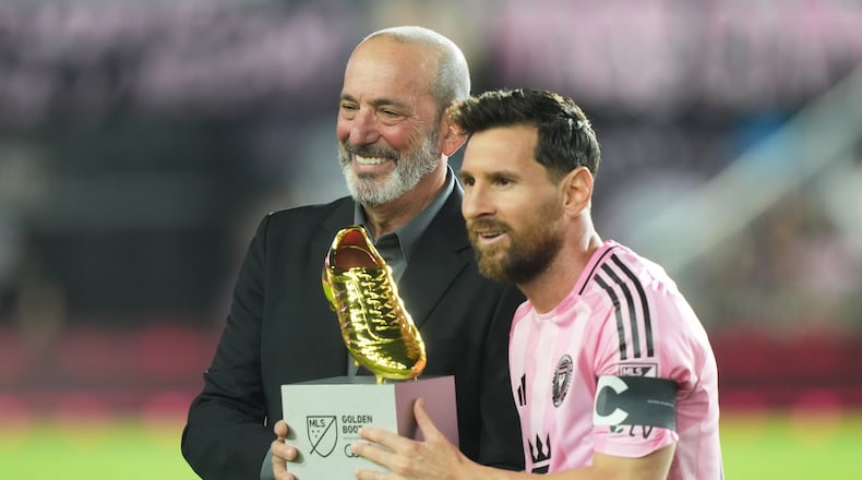 MLS Commissioner Don Garber presents the Golden Boot award to Inter Miami forward Lionel Messi before match one of their MLS playoff opening round soccer match against the Nashville SC, Friday, Oct. 24, 2025, in Fort Lauderdale, Fla. (AP Photo/Marta Lavandier)