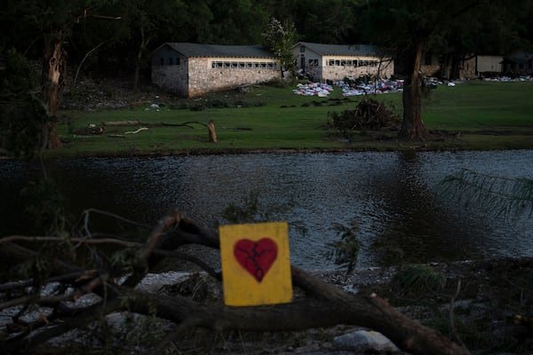 A broken heart sign is displayed near Camp Mystic on Tuesday, July 8, 2025, after a flash flood swept through the area in Hunt, Texas. (AP Photo/Eli Hartman)