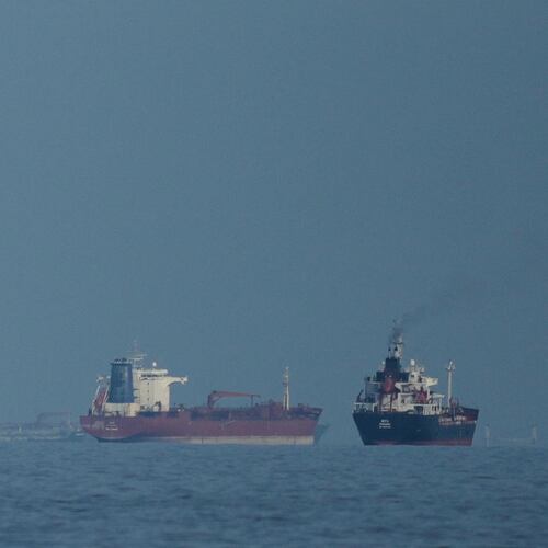 FILE - Oil tankers and cargo ships line up in the Strait of Hormuz as seen from Khor Fakkan, United Arab Emirates, Wednesday, March 11, 2026. (AP Photo/Altaf Qadri,File)