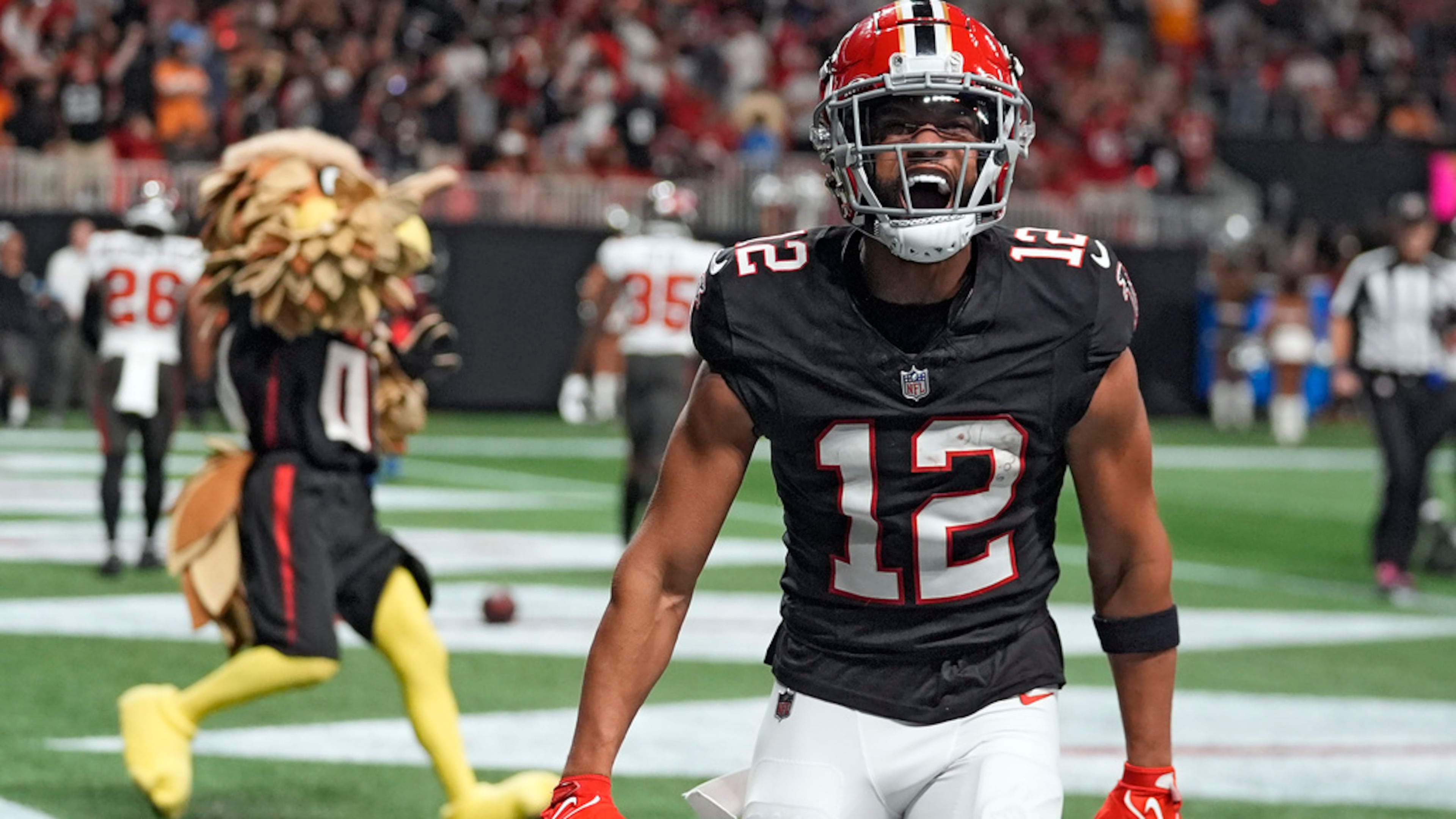 KhaDarel Hodge (center) and the Atlanta Falcons celebrated two wins over the Buccaneers last season — one on Oct. 4 when Hodge scored the game-winning touchdown in overtime in Atlanta (pictured) and the second one Oct. 27 in Tampa, Florida. The Falcons and Bucs open the 2025 NFL season on Sept. 7 at Mercedes-Benz Stadium. (John Bazemore/AP 2024)