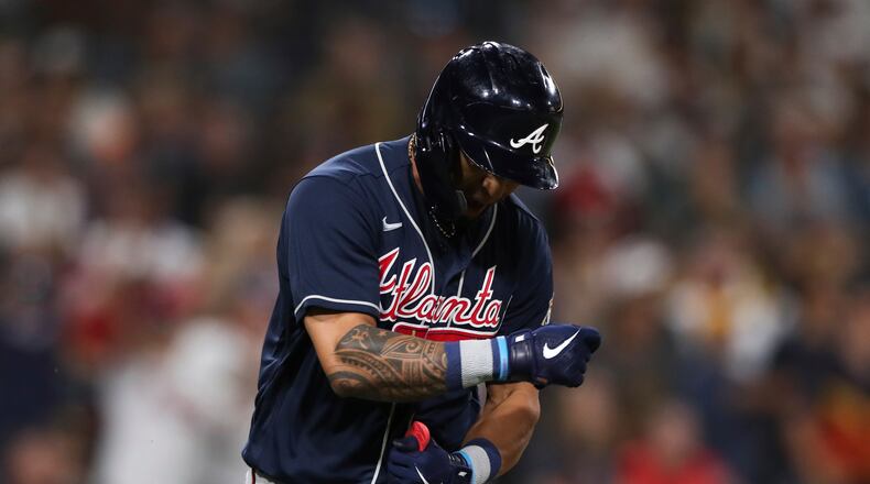 Atlanta Braves' Eddie Rosario reacts after hitting an RBI-single against the San Diego Padres in the ninth inning of a baseball game Saturday, Sept. 25, 2021, in San Diego. (AP Photo/Derrick Tuskan)
