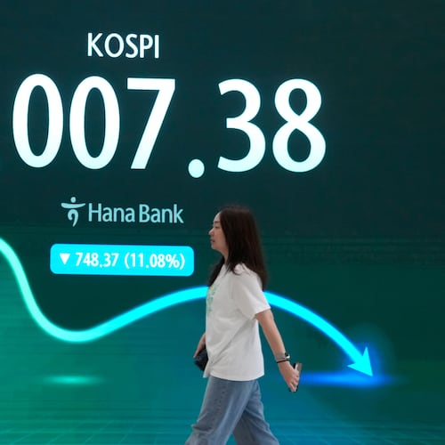 A screen shows the Korea Composite Stock Price Index (KOSPI) at the foreign exchange dealing room of the Hana Bank headquarters in Seoul, South Korea, Tuesday, July 28, 2026. (AP Photo/Ahn Young-joon)
