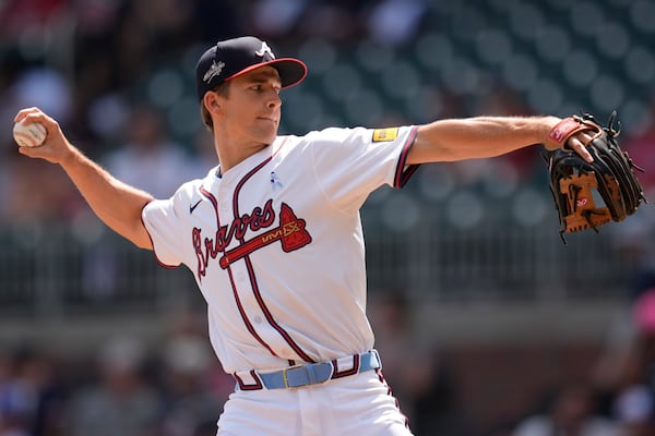 Braves infielder Luke Williams looked totally natural and intimidating on the mound during Sunday's game against the Rockies. 