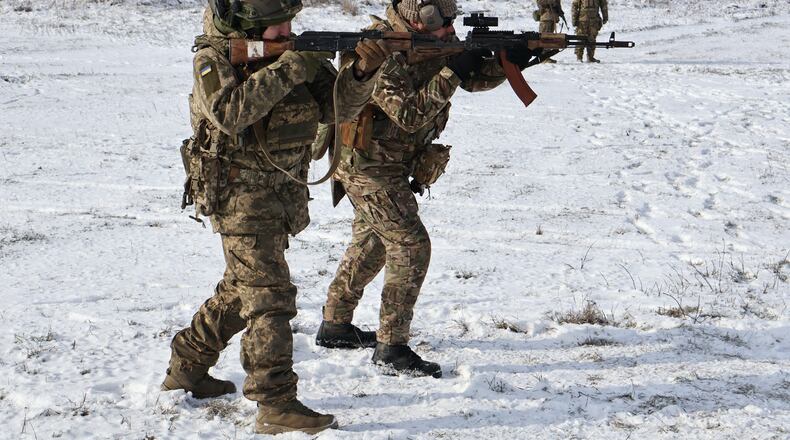 CORRECTS DATE In this photo provided by Ukraine's 65th Mechanized Brigade press service, recruits perform drills at a training ground in the Zaporizhzhia region, Ukraine, Tuesday, Jan. 20, 2026. (Andriy Andriyenko/Ukraine's 65th Mechanized Brigade via AP)