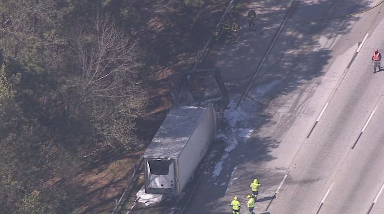 A tractor-trailer carrying paint caught on fire on I-285 in Cobb County.
