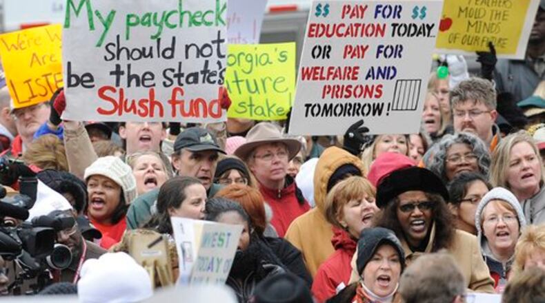 A retired University of Georgia education professor says Georgia asks a lot of its teachers and schools, but are taxpayers willing to invest more in schools to reach these higher, more ambitious goals? Educators have long protested that the state adds more responsibilities to their jobs without a commensurate increase in compensation. (AJC file photo)