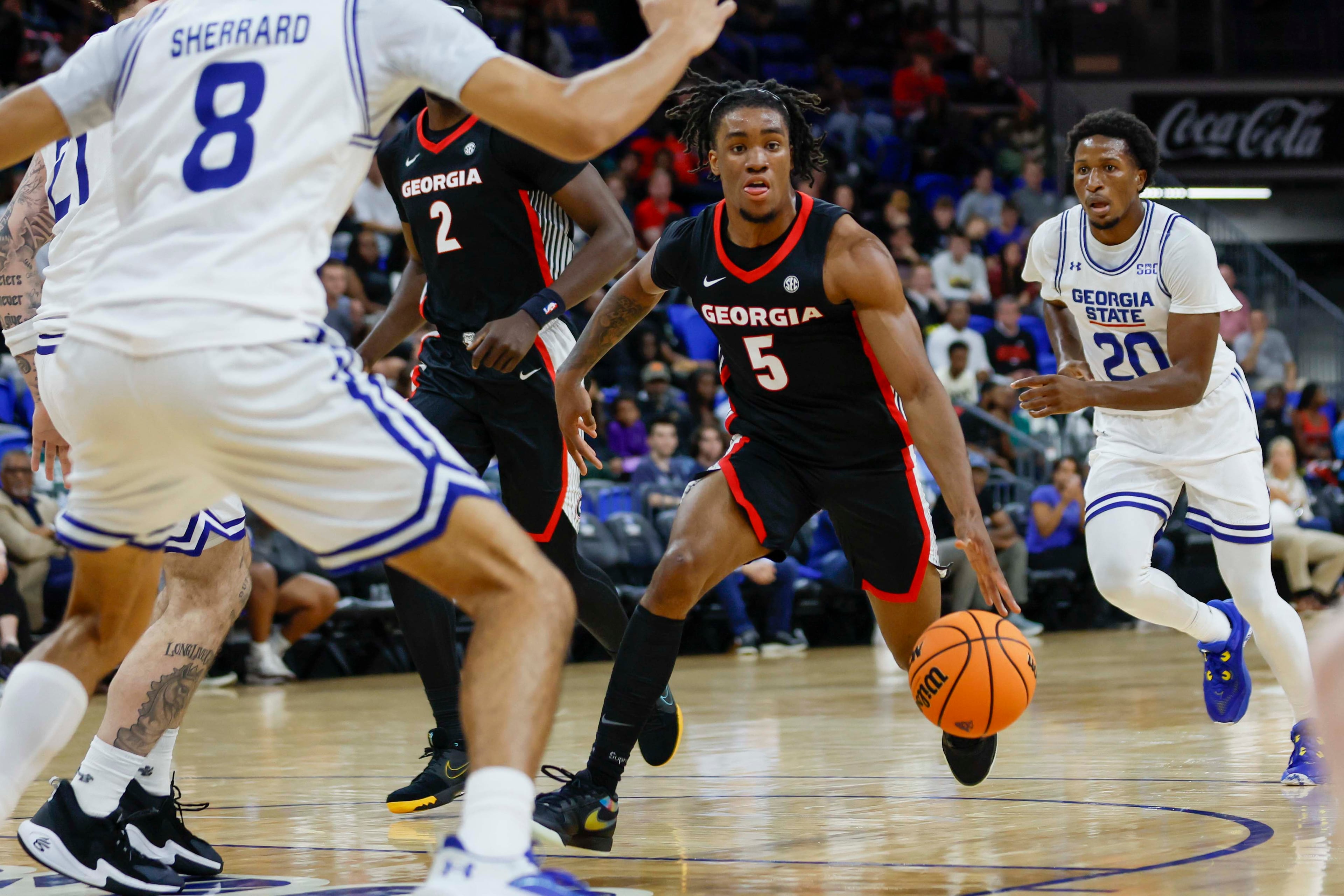 Georgia Bulldogs guard Jeremiah Wilkinson (5) drbbles the ball during the first half of an exhibition opener game against the Georgia State Panthers at the Georgia State Convocation Center, Wednesday, October 15, 2025, in Atlanta. (Miguel Martinez/ AJC)