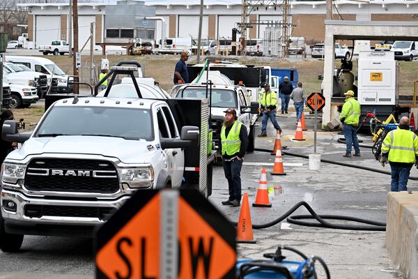 Trucks arrive at the Georgia Department of Transportation’s Forest Park Maintenance Facility to load brine on Friday, Jan. 23, 2026. The department plans to reapply brine continuously to counteract rain washing it away. (Hyosub Shin/AJC)