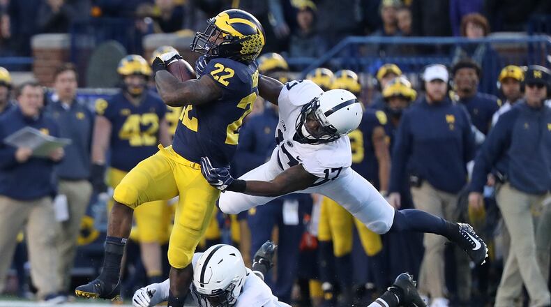 Here running against Penn State, Karan Higdon is among the Michigan stars not playing in Saturday's Peach Bowl.