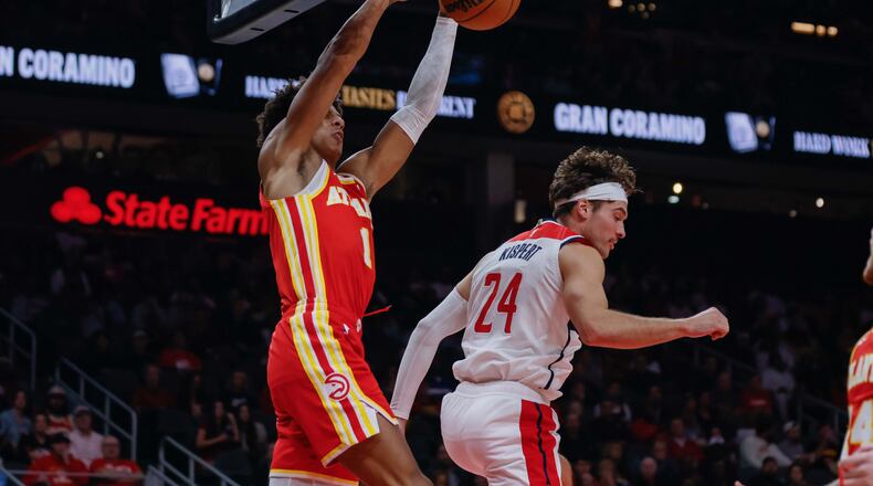 Atlanta Hawks forward Jalen Johnson (1) dunks the ball against Washington Wizards forward Corey Kispert (24) during the first half at State Farm Arena on Monday, October 28, 2024, in Atlanta.
(Miguel Martinez/ AJC)