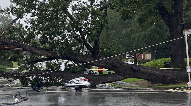 A massive oak tree fell down in Dunwoody, smashing two vehicles.