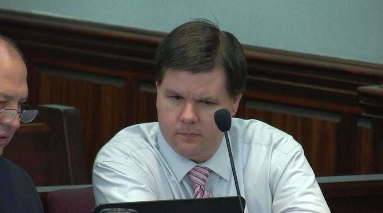 Justin Ross Harris studies a laptop during his murder trial at the Glynn County Courthouse in Brunswick, Ga., on Wednesday, Oct. 19, 2016. (screen capture via WSB-TV)