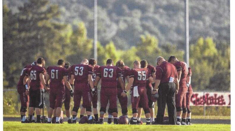 This photo, which shows Chestatee High School football players praying, was one of several that triggered complaints from the American Humanist Association. (The Times, Gainesville)