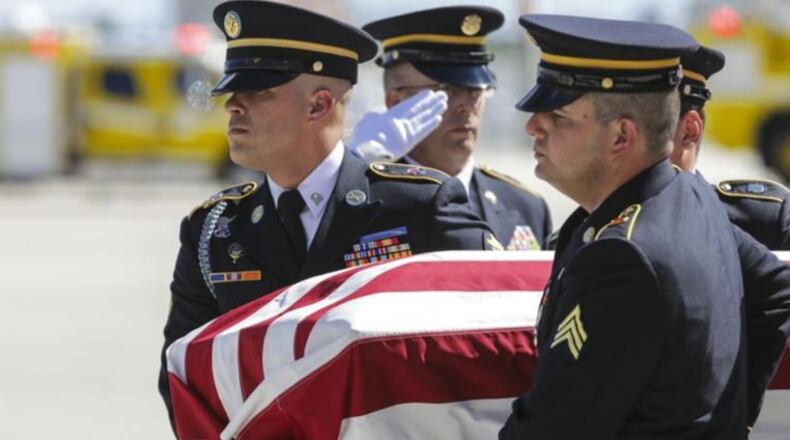 The remains of US Army Sgt. Richard Sowell are moved to a hearse by the US Army Honor Guard after arriving at PBIA Wednesday, November 8, 2017. “Tiny” Sowell’s buddies saw the popular Palm Beach High grad be blown to bits by Japanese explosives on Saipan, but they couldn’t get to his mangled body to bring him home. It would take seven decades, and 21st century technology, and a persistent nephew, but Tiny finally is coming home.