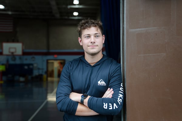 Nate Monteiro, 17, who grew up in the East Providence Boys and Girls Club and now works at the club, poses for a portrait at Emma G. Whiteknact Elementary School on Thursday, July 10, 2025, in Providence, R.I. (AP Photo/Sophie Park)