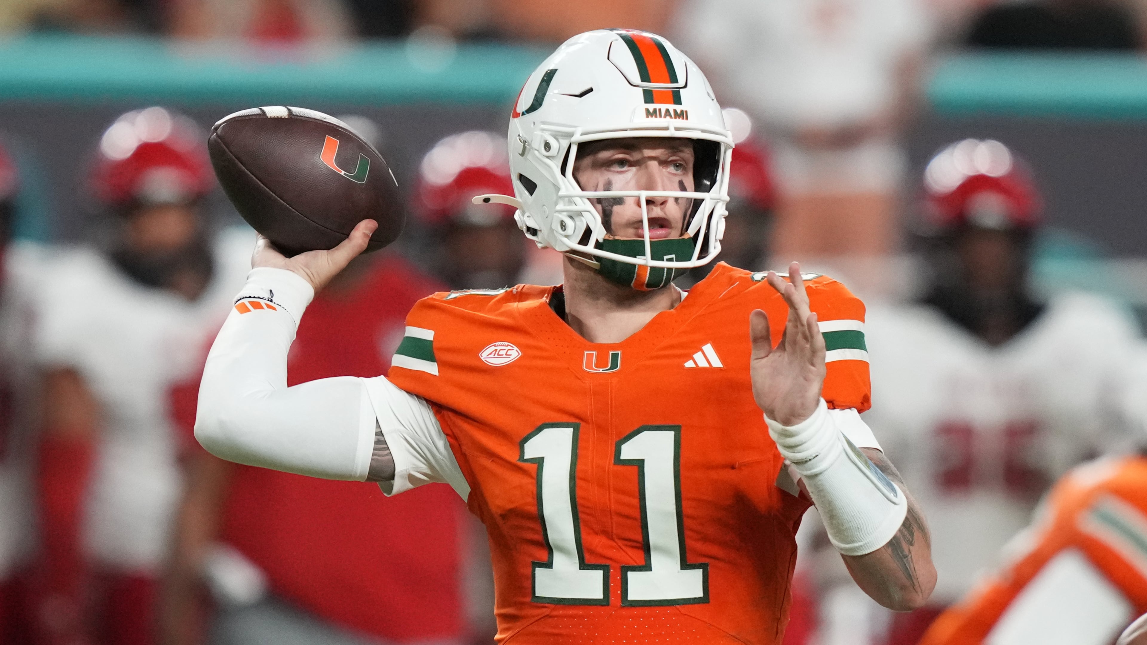 Miami quarterback Carson Beck (11) throws during the second half of an NCAA college football game against North Carolina State, Saturday, Nov. 15, 2025, in Miami Gardens, Fla. (AP Photo/Lynne Sladky)