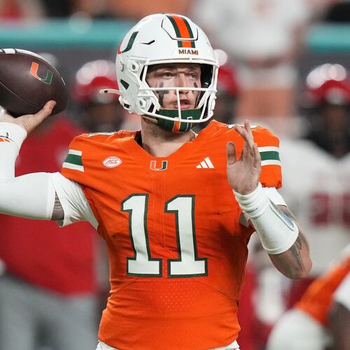 Miami quarterback Carson Beck (11) throws during the second half of an NCAA college football game against North Carolina State, Saturday, Nov. 15, 2025, in Miami Gardens, Fla. (AP Photo/Lynne Sladky)