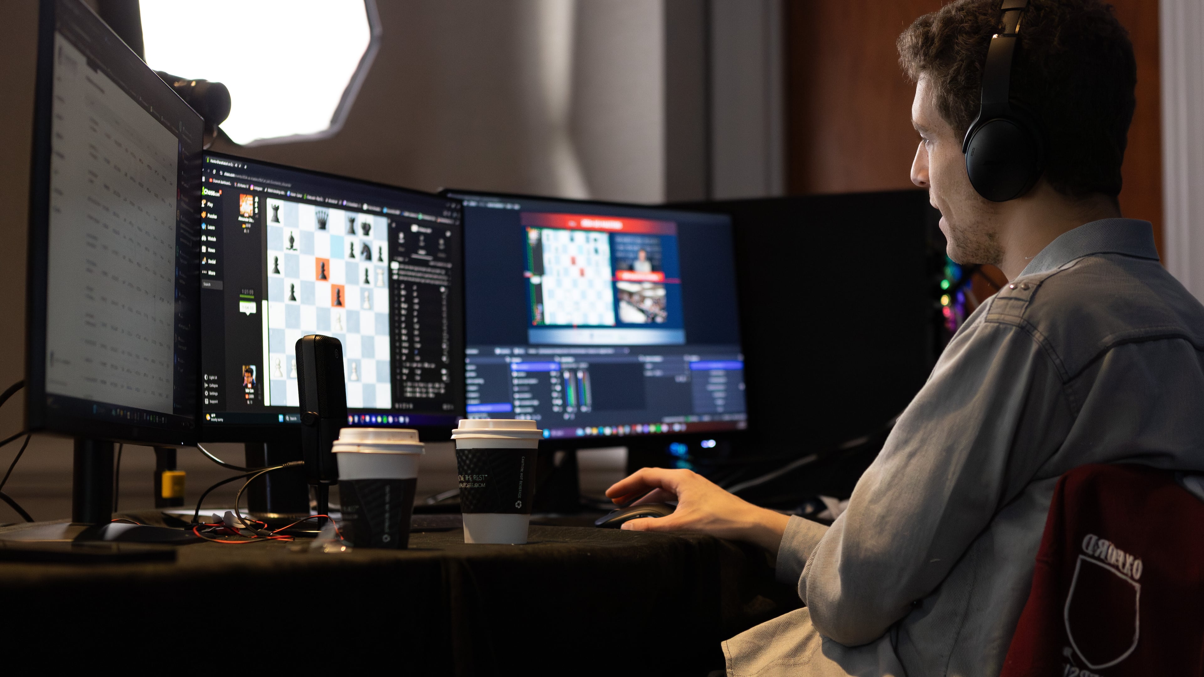 This undated photo released by Charlotte Chess Center shows Daniel Naroditsky playing chess at the computer. (Kelly Centrelli/Charlotte Chess Center via AP)