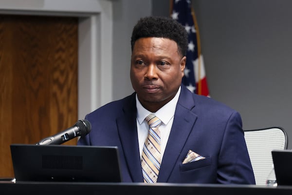 Fairburn City Council member Samuel Perry reacts during the council meeting on Monday, Jan. 12, 2026. The council appointed Perry late last year to replace ousted council member Samantha Hudson. (Jason Getz/AJC)