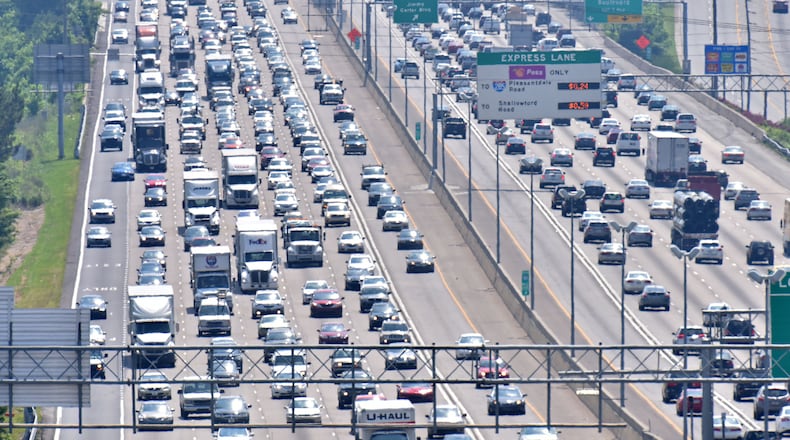 HEADED OUT OF TOWN--May 27, 2016 Norcross - Afternoon rush hour traffic on was backed up for miles in both directions on I-85 in Gwinnett County on Friday, May 27, 2016. HYOSUB SHIN / HSHIN@AJC.COM