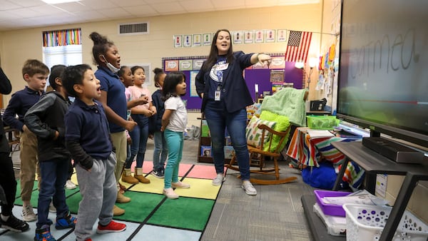 A teacher uses a touchscreen to teach students the “Science of Reading" at Dunleith Elementary School in 2023. 