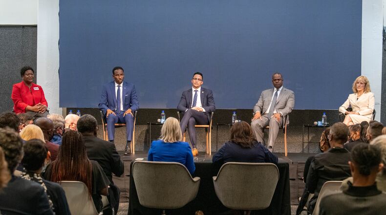 October 7, 2021 Atlanta - Mayoral candidates (from left) Felicia Moore, Andre Dickens, Antonio Brown, Kasim Reed and Sharon Gay during City of Atlanta Mayoral Debate at The Gathering Spot in Atlanta on Thursday, October 7, 2021. (Hyosub Shin / Hyosub.Shin@ajc.com)