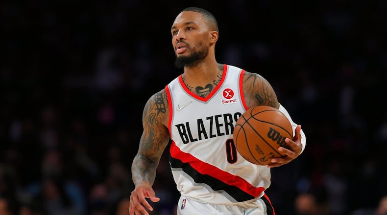 Portland Trail Blazers guard Damian Lillard (0) seen playing the Los Angeles Lakers in an NBA basketball game, Friday Dec. 31, 2021, in Los Angeles. (AP Photo/John McCoy)