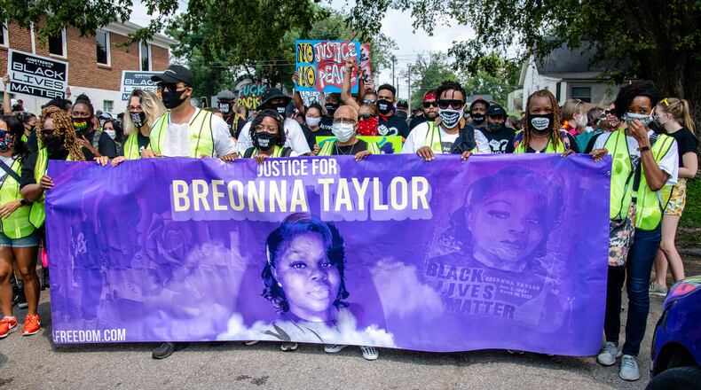 FILE - Protesters participate in the Good Trouble Tuesday march for Breonna Taylor, on Tuesday, Aug. 25, 2020, in Louisville, Ky. (Amy Harris/Invision/AP, File)