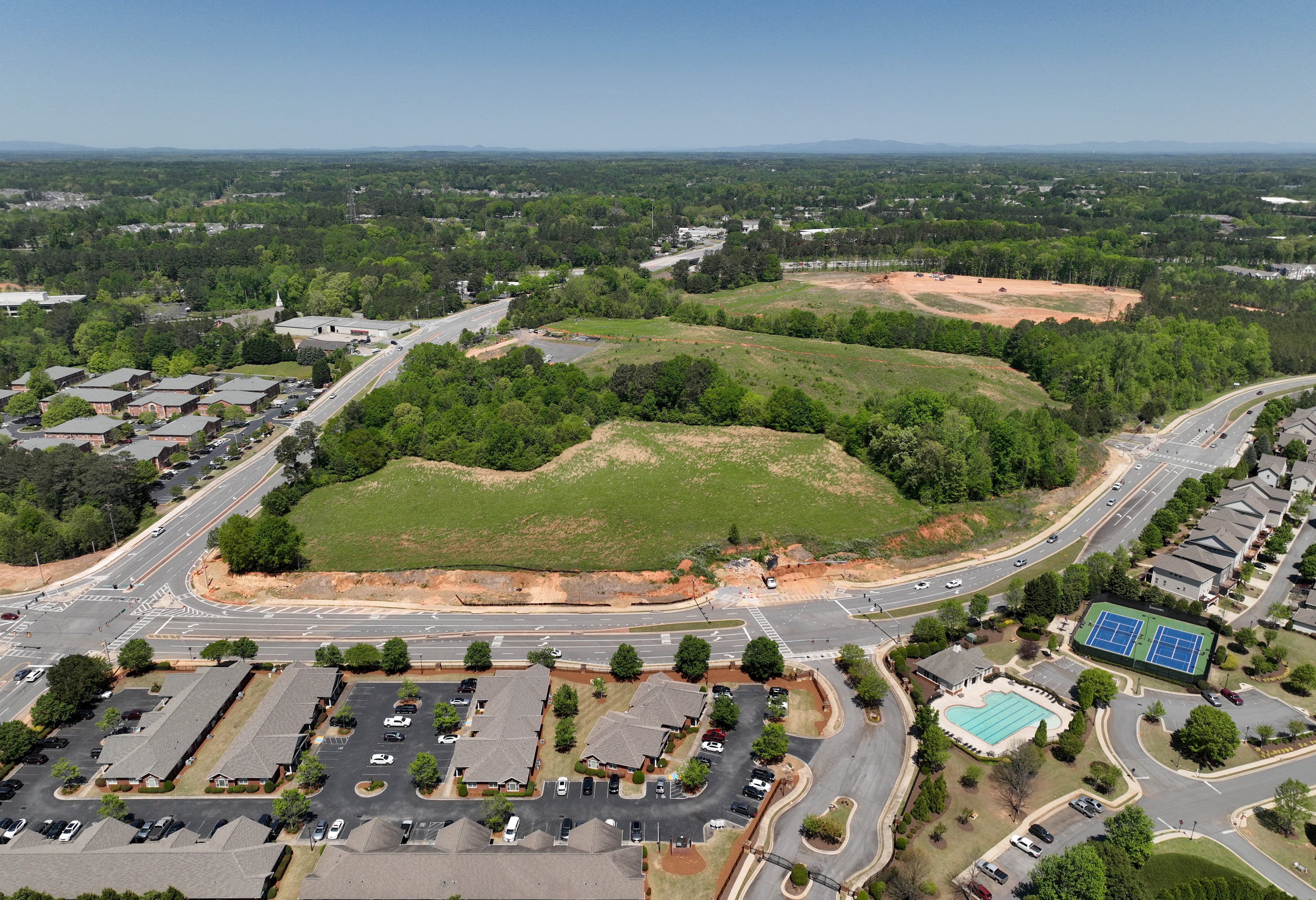 Aerial photograph shows a proposed mixed-use development and arena with the goal of bringing a NHL franchise back to metro Atlanta, along Ga. 400, Tuesday, April 18, 2023, in Alpharetta. The project, called The Gathering at South Forsyth, aims to transform roughly 100 acres along Ga. 400 into an entertainment hub centered around an 18,000-seat arena. (Hyosub Shin / Hyosub.Shin@ajc.com)