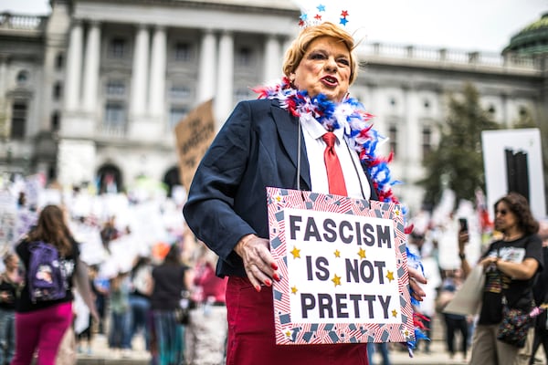 Protesters rally at the state capitol in Harrisburg, Pa., during the Day of Action protest against the Trump Administration. Saturday, April 19, 2025. (Zach Gleiter/The Patriot-News via AP)