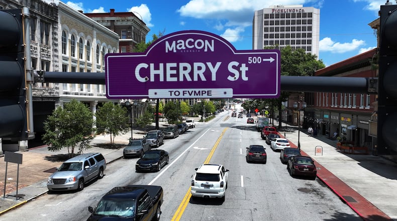 Street signs in downtown Macon now feature both English and Muscogee language names as part of an effort to honor the history and traditions of the area's original inhabitants. (Hyosub Shin/AJC)