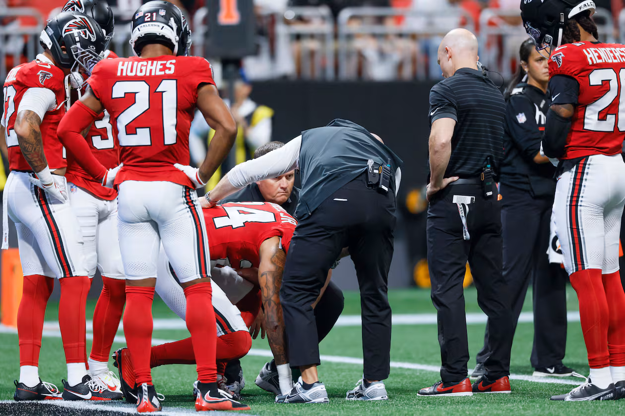 Atlanta Falcons cornerback A.J. Terrell Jr. (24) receives assistance from the medical staff after an injury timeout in the first half of an NFL game against the Carolina Panthers at Mercedes-Benz Stadium in Atlanta on Sunday, Sept. 20, 2026. (Miguel Martinez/AJC)