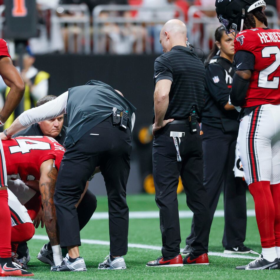 Atlanta Falcons cornerback A.J. Terrell Jr. (24) receives assistance from the medical staff after an injury timeout in the first half of an NFL game against the Carolina Panthers at Mercedes-Benz Stadium in Atlanta on Sunday, Sept. 20, 2026. (Miguel Martinez/AJC)
